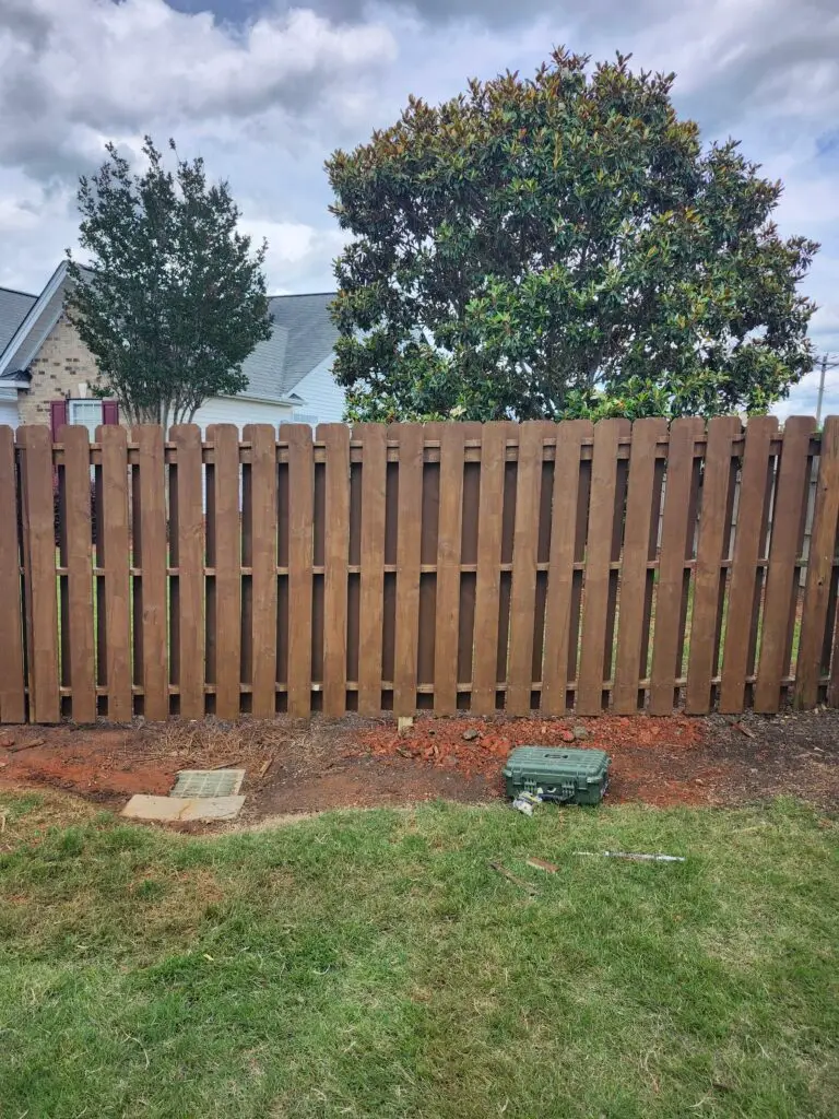 Fence Repair and Staining in Greenville — discolored wood staining